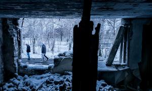 People outside a residential building destoryed by shelling in Marinka, Ukraine. (file)